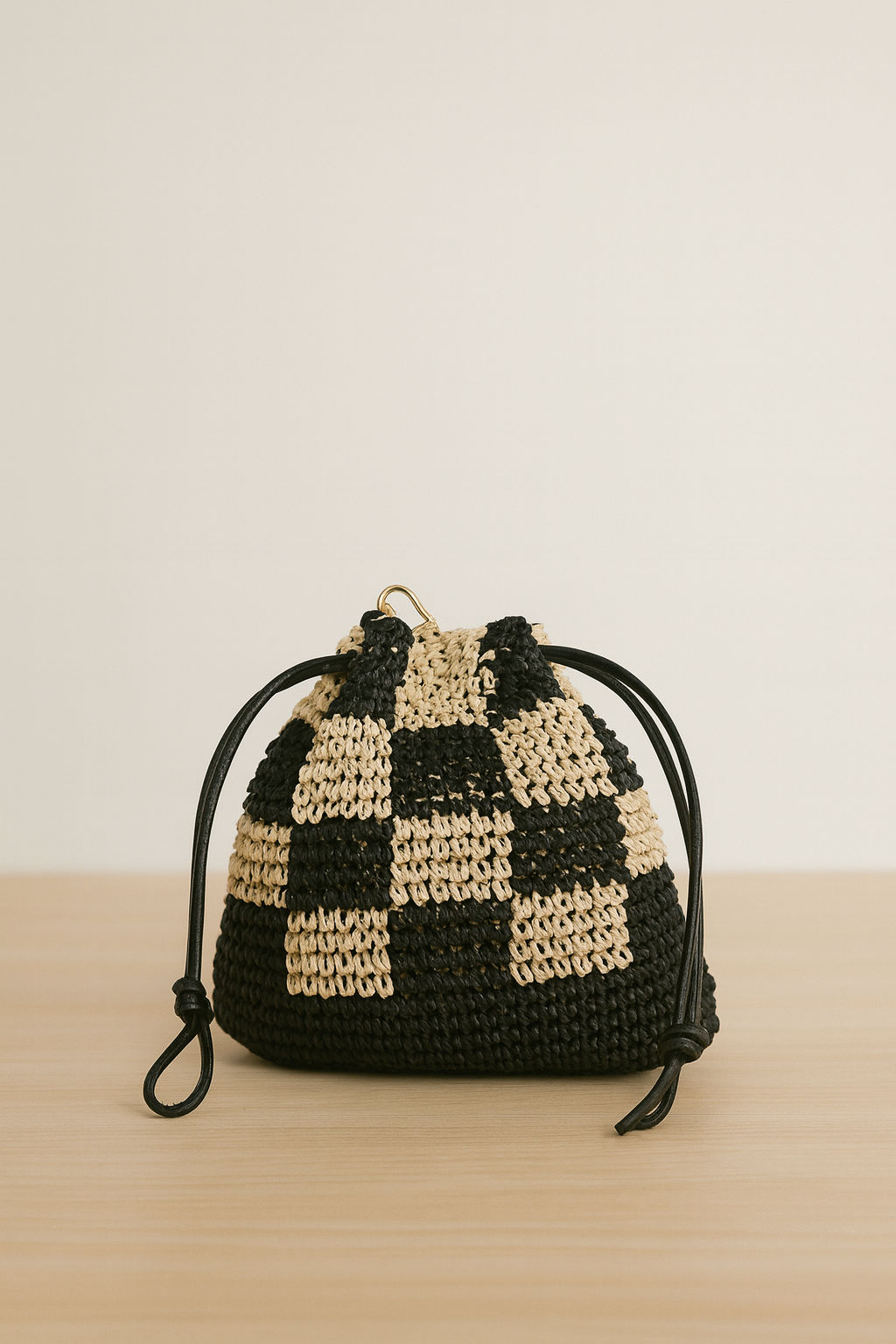 Black and White Woven Bucket Bag with Adjustable Closure